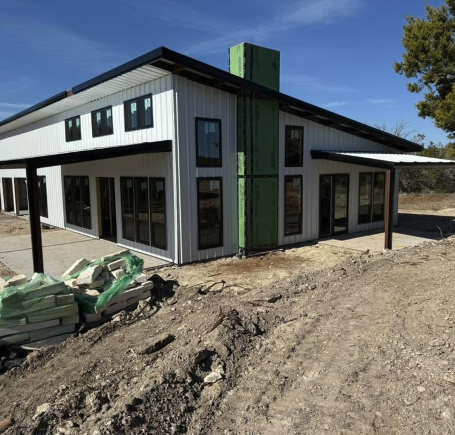 Barndominium under construction with sheathing still exposed