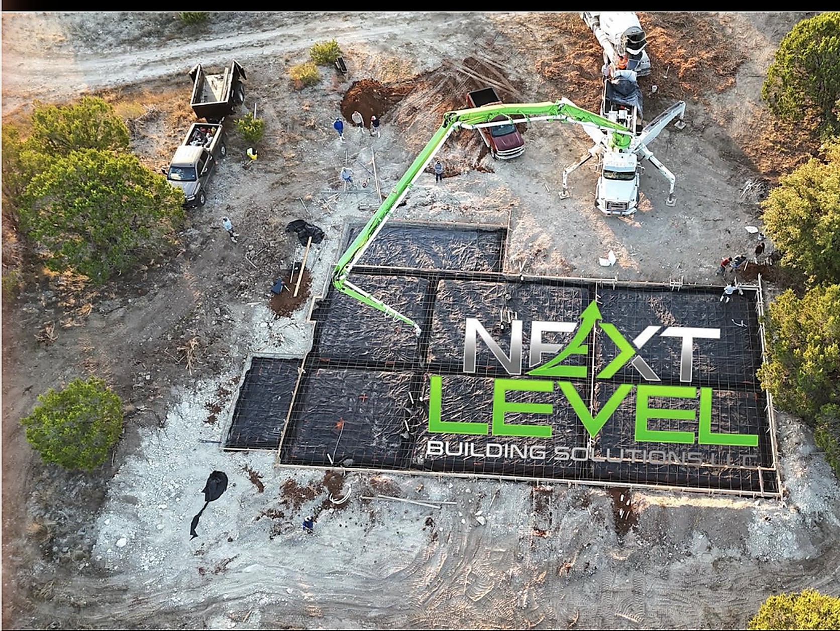 Aerial view of a slab pour with the pump truck set up
