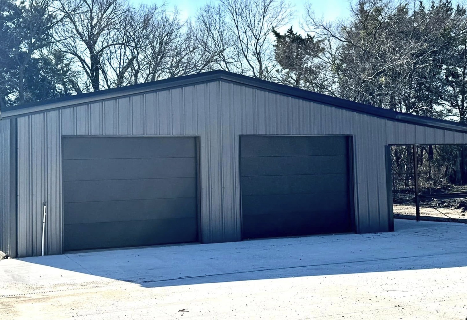 Grey two bay shop with an attached lean to