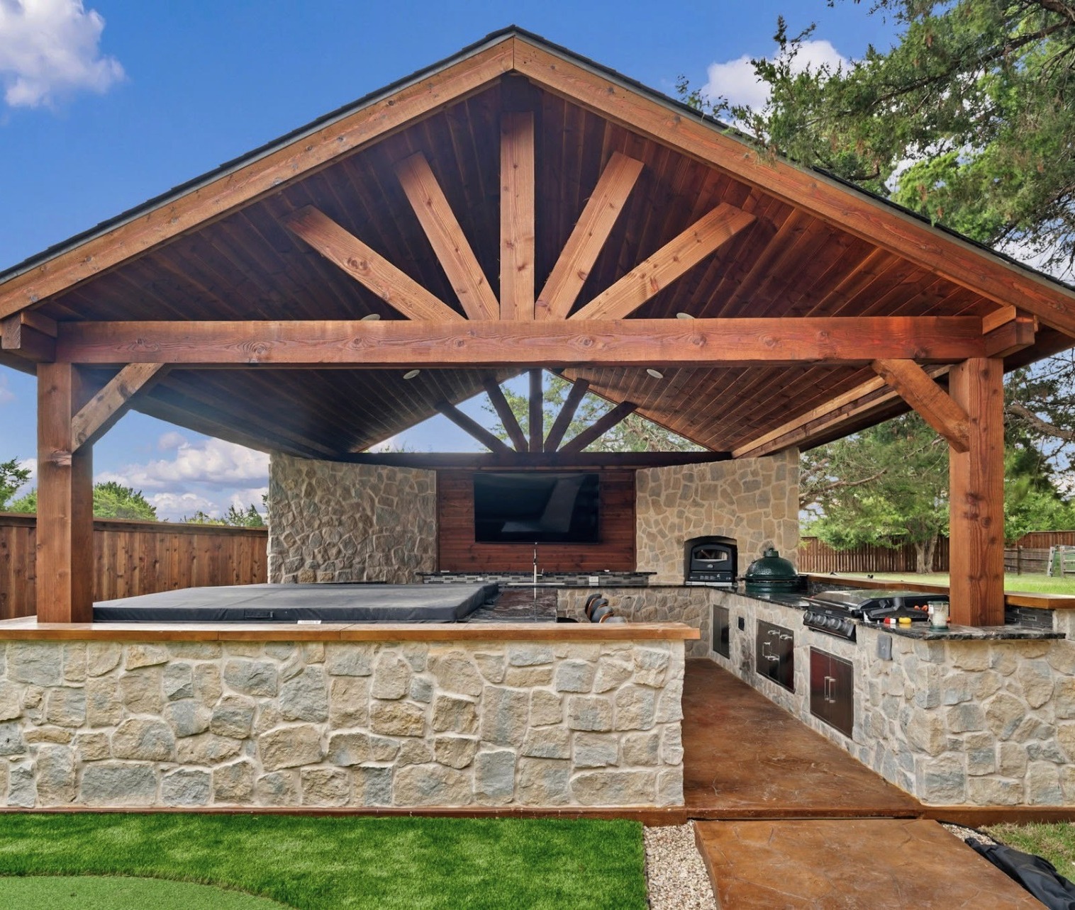 Timber gable pavilion with spa and stone counter