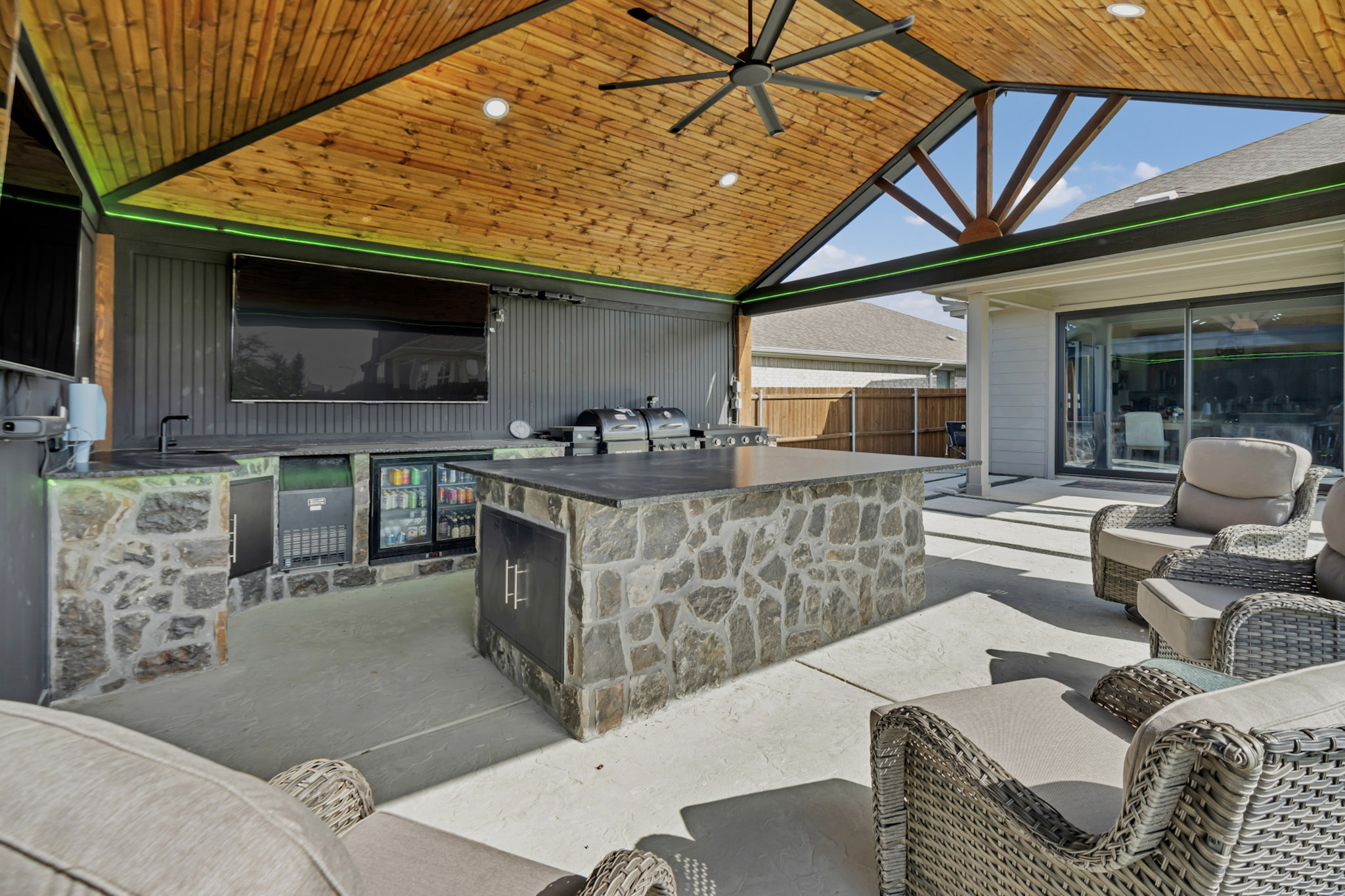 Timber framed gable pavilion with a tongue and groove cedar ceiling and a large fan